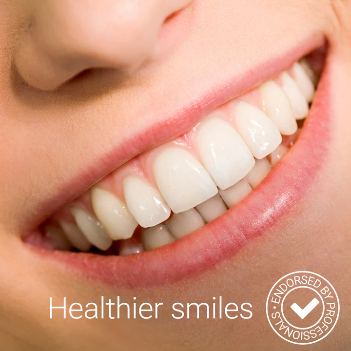 Close-up of a healthy, bright smile after using the HydraSmile water flosser
